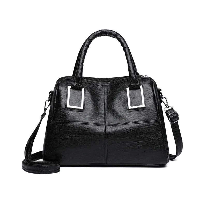 Simple large capacity women's shoulder bag in a neutral colour with internal phone and document pockets.