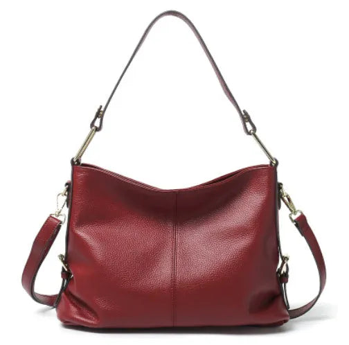 Genuine leather vertical square crossbody bag in black with multiple internal organiser pockets.