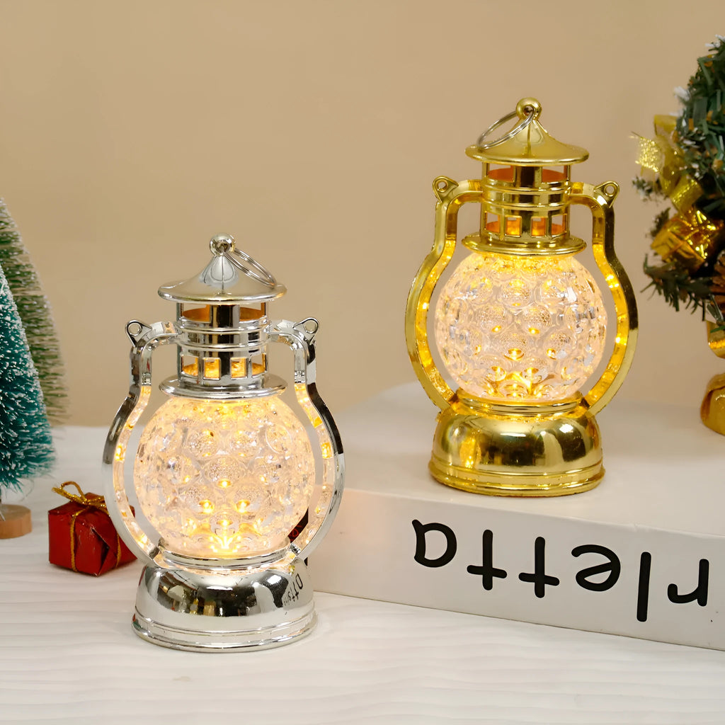 Creative retro-style oil lamp LED night light in gold or silver finish on a dark surface