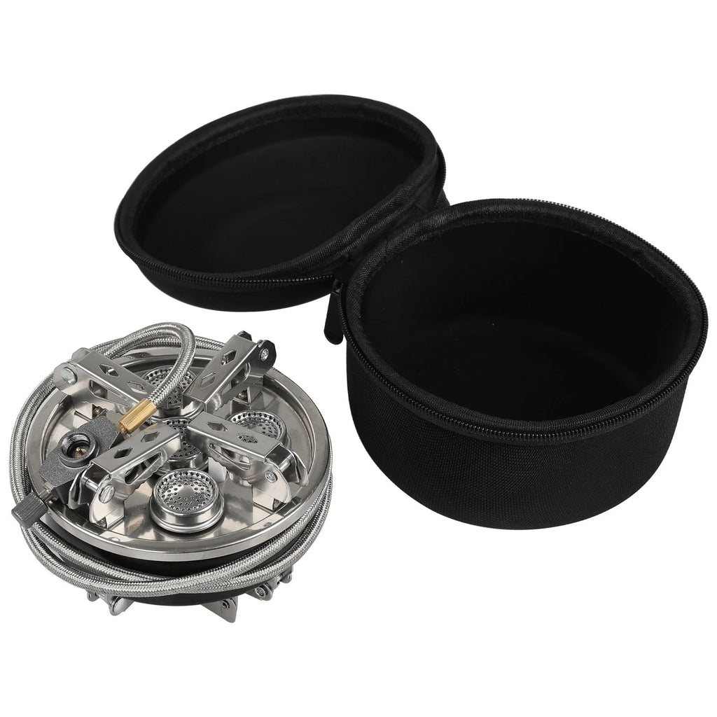 Silver portable split stove for outdoor camping and picnics on a flat surface.