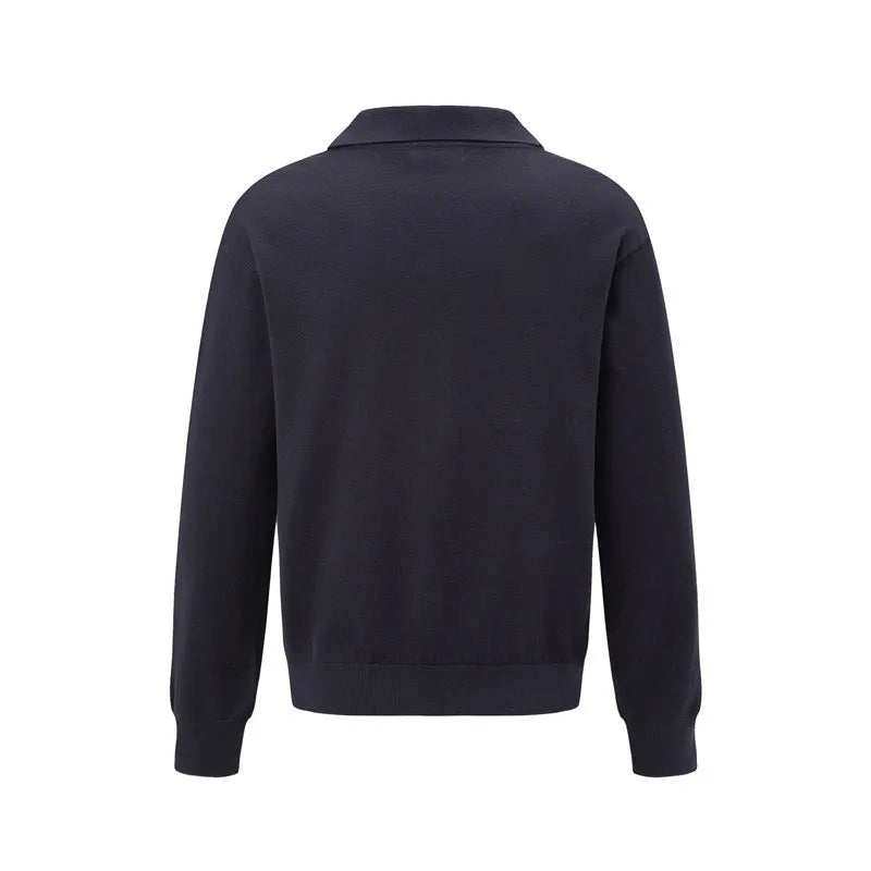 Loose-fitting pullover sweater in black, dark grey, and creamy-white colours