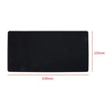 Large felt mouse pad in black on office desk with keyboard and mouse, 325x635mm
