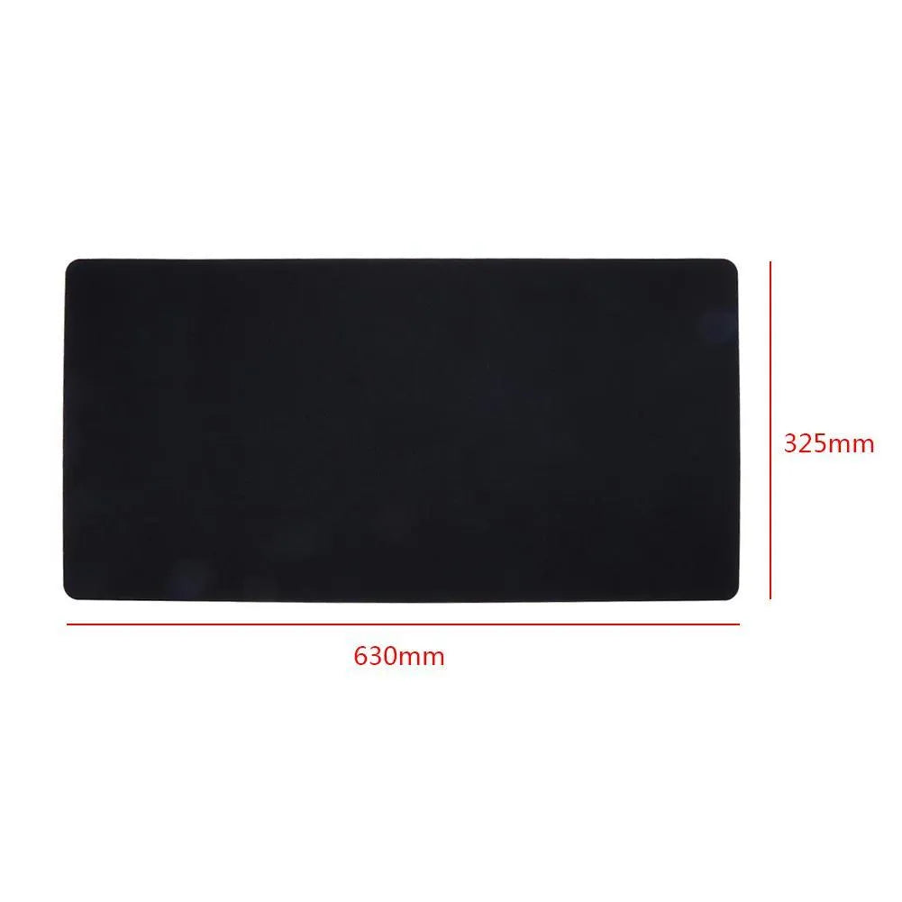 Large felt mouse pad in black on office desk with keyboard and mouse, 325x635mm
