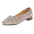 Women's black and white canvas casual shoes with pointed toe and flat rubber sole