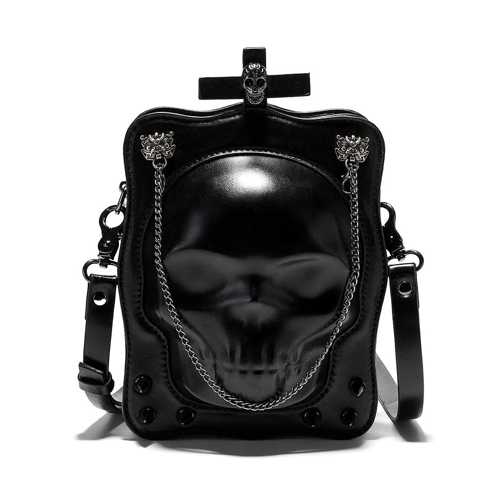 Black mini square crossbody bag with detailed skull embossing, rivets, and a shoulder strap.