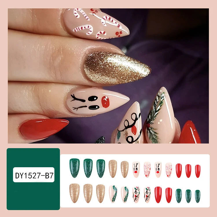 Christmas false nails with festive hat, striped, and snowflake designs for holiday parties