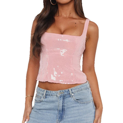 Women's solid pink polyester vest with slim fit design on hanger showing medium elastic fabric texture