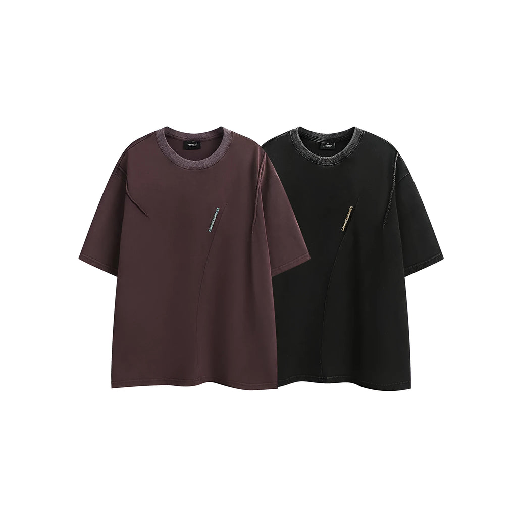 Loose fit purple short-sleeved cotton T-shirt with retro embroidery on a hanger.