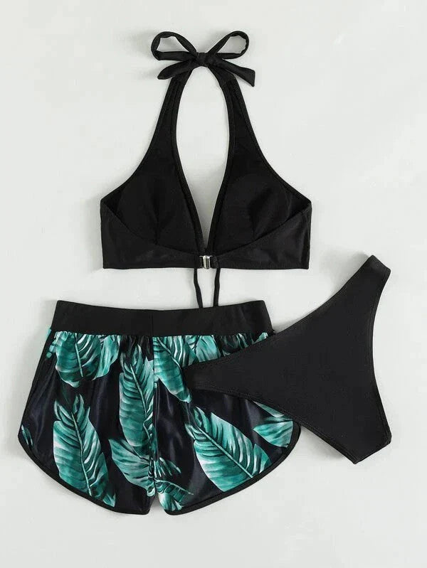 Chic leaf-patterned women's swimsuit set with bikini top, bottoms, and matching shorts in various vibrant colors
