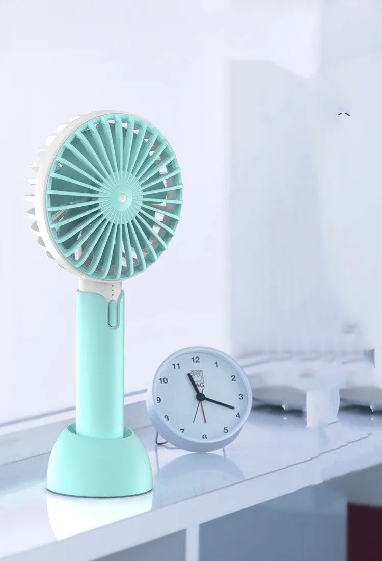 Blue handheld and desktop mini USB electric fan with three speed settings.