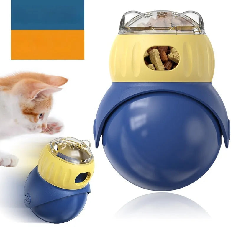 Yellow and blue plastic owl-shaped tumbler puzzle feeder for cats on a plain background.
