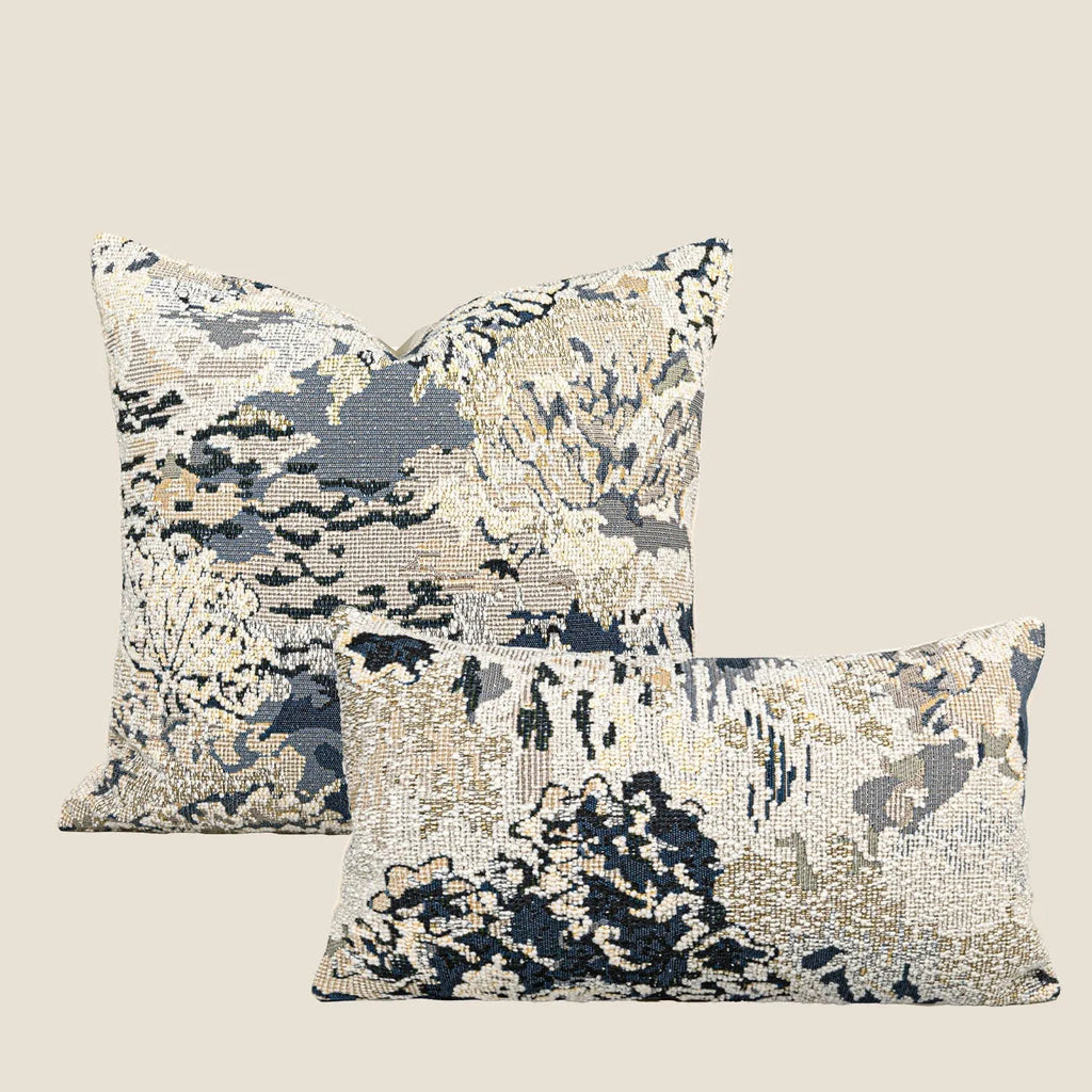 Antique blue decorative pillow with floral plant pattern, shown in square and waist pillow sizes.