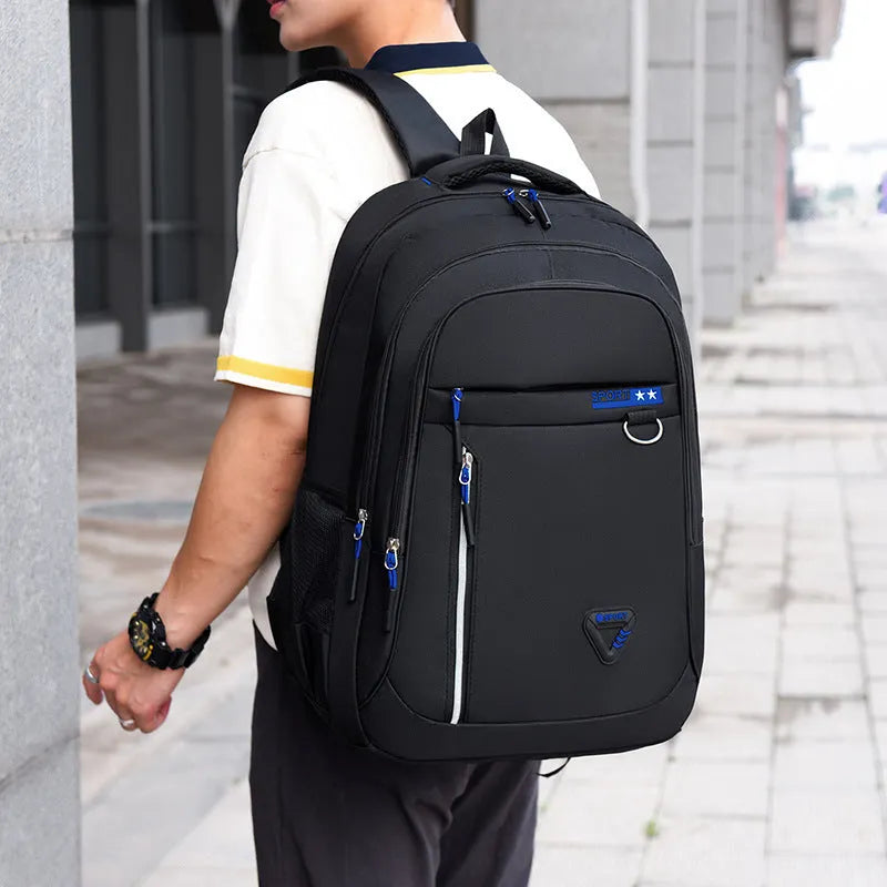 Men's Oxford cloth schoolbag with letter pattern design showing air pillow belt burden reduction system