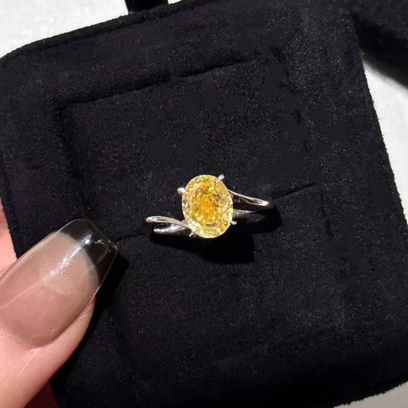 Yellow rock sugar crystal colour copper ring for women on a ring stand.