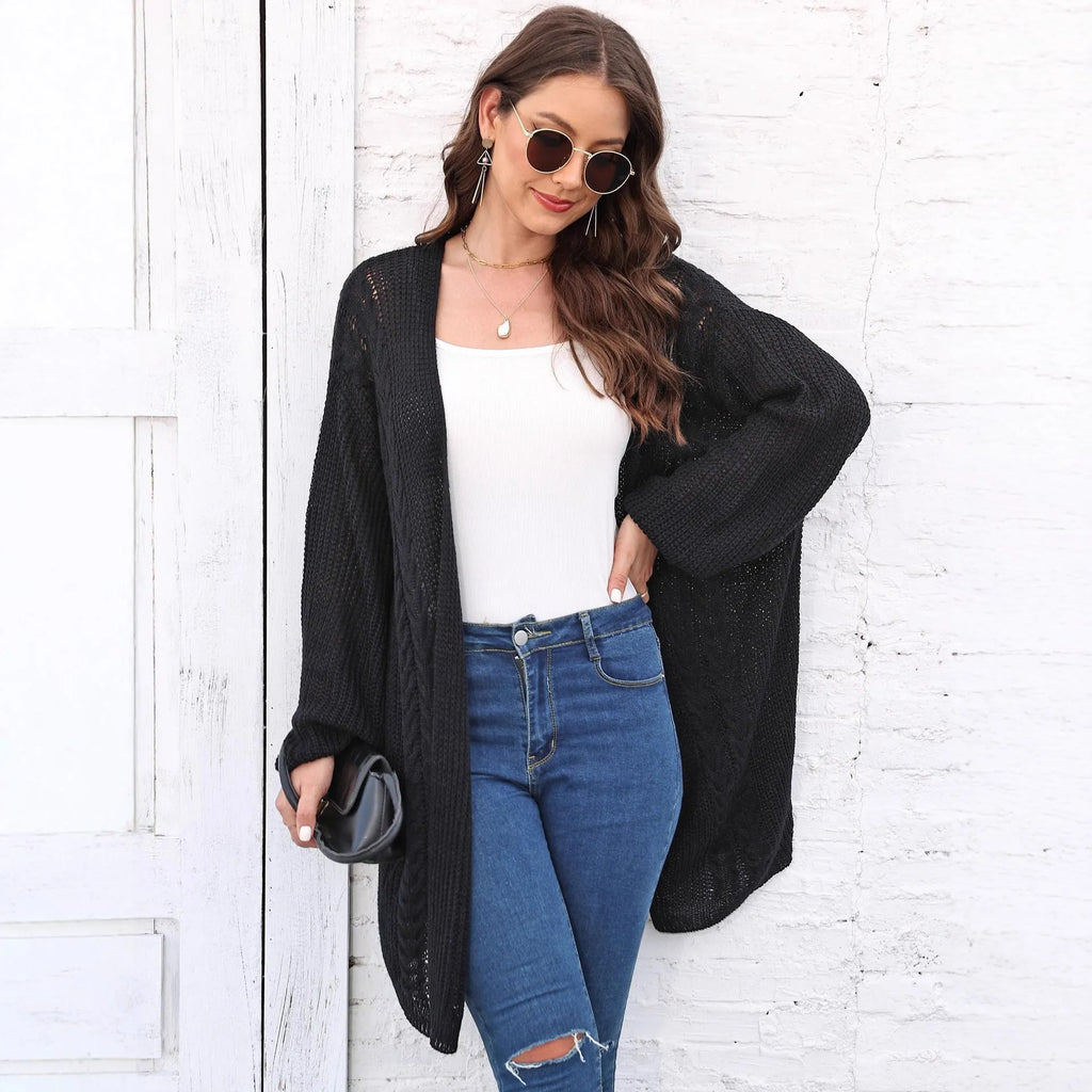 Women's loose brown acrylic sweater coat showing front detail and casual fit.