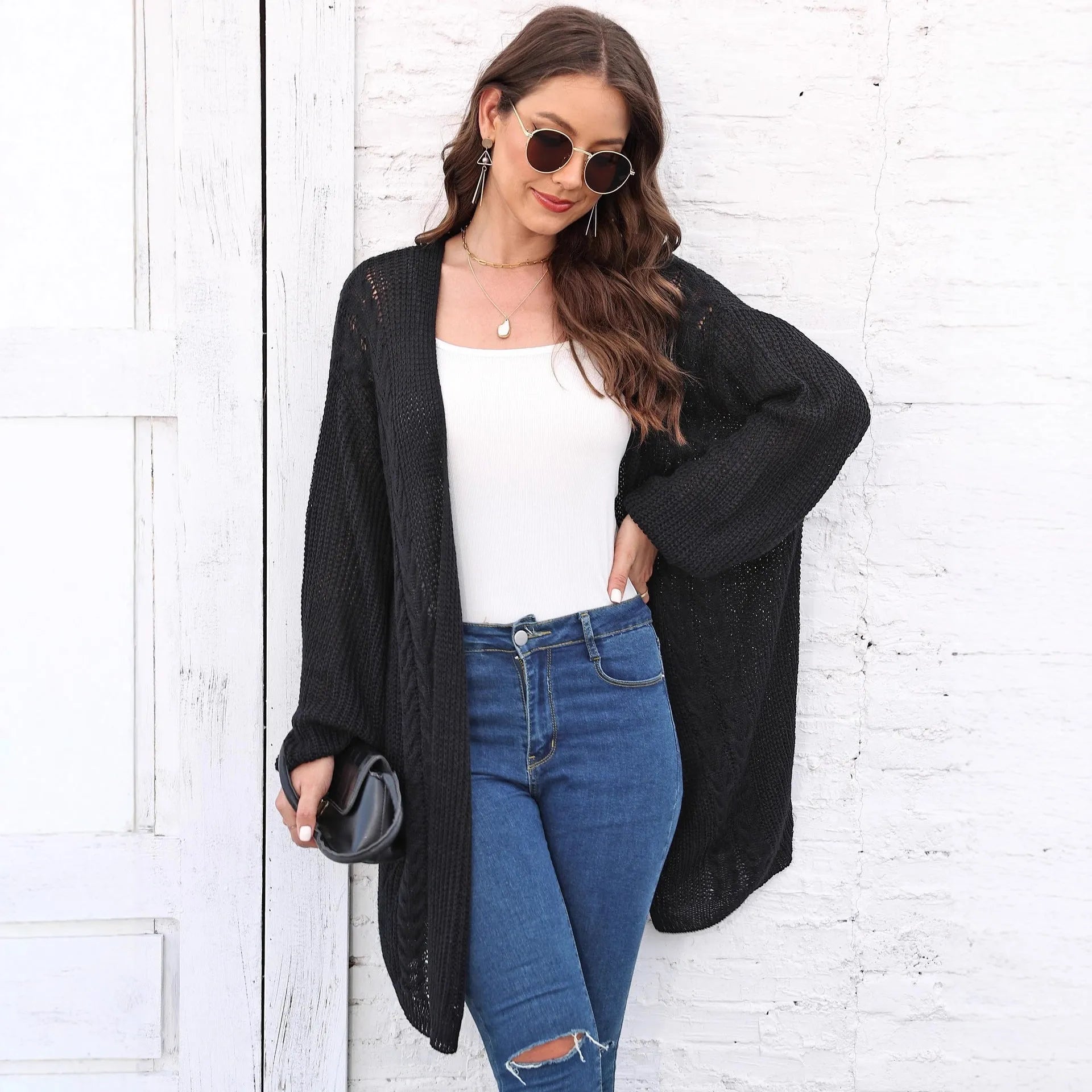 Women's loose brown acrylic sweater coat showing front detail and casual fit.