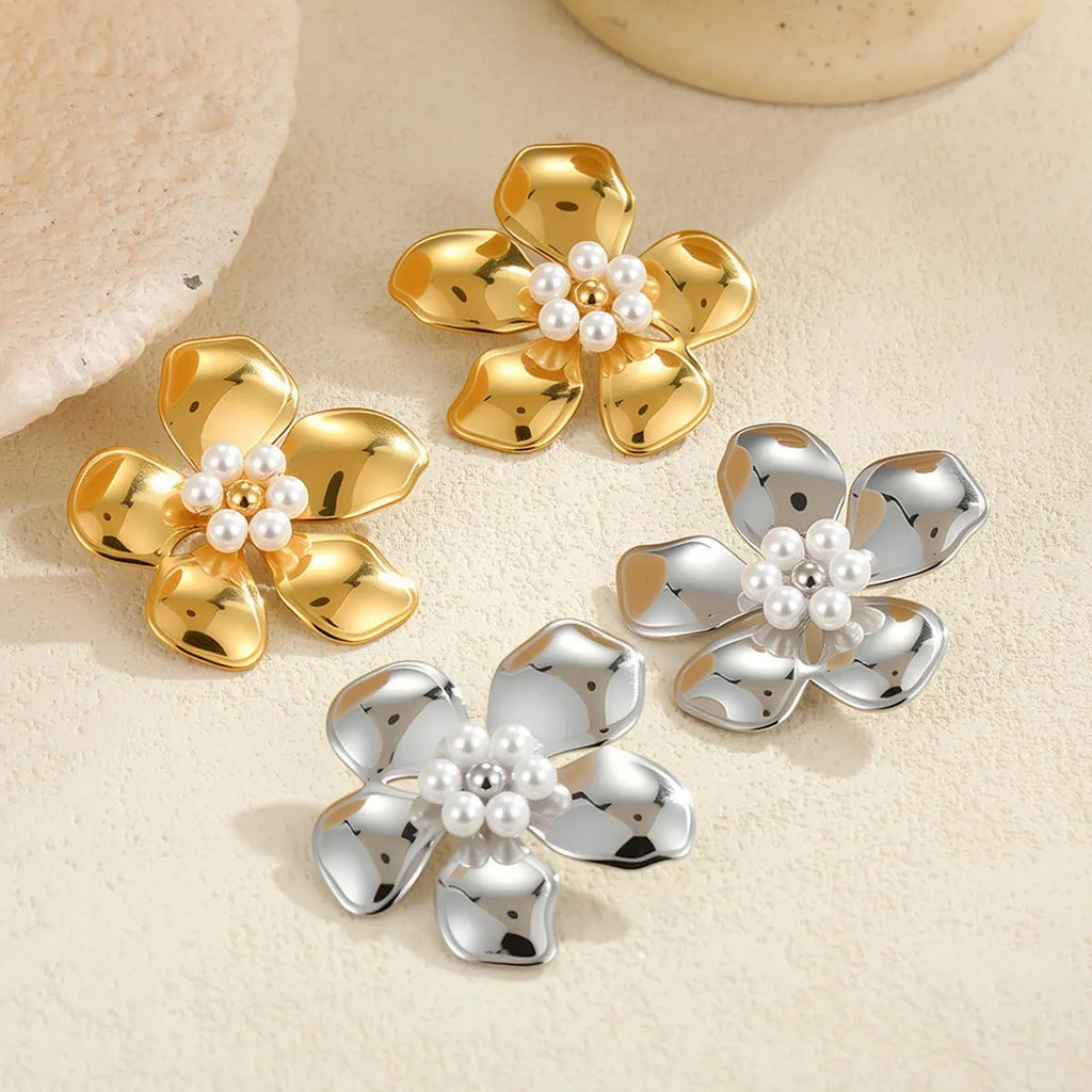 Flower stringed pearls stud earrings in gold and steel colour on white background