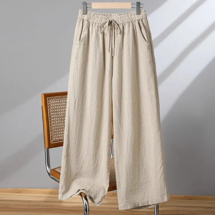 Women's straight-leg casual trousers with elastic drawstring waist in apricot colour.