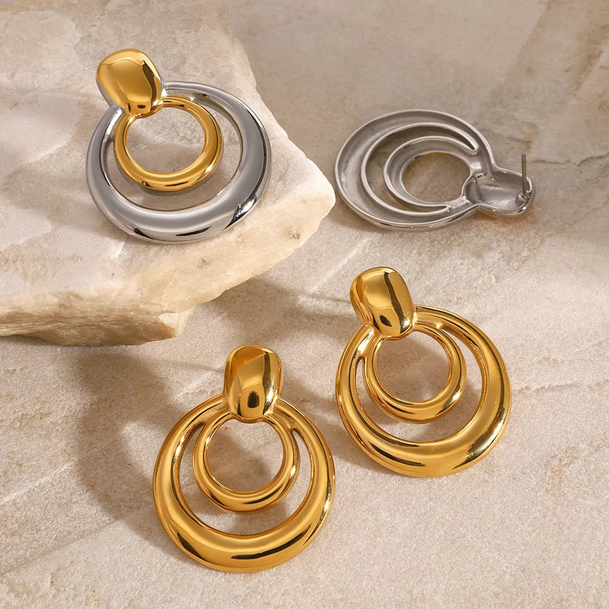 Round double layer hollow stud earrings with geometric design in electroplated 18K gold finish