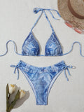 Denim blue printed bikini set with criss-cross straps on the top.
