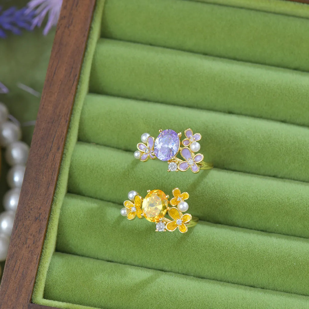 Women's open ring with flower design and zircon detail in light purple or yellow colour options