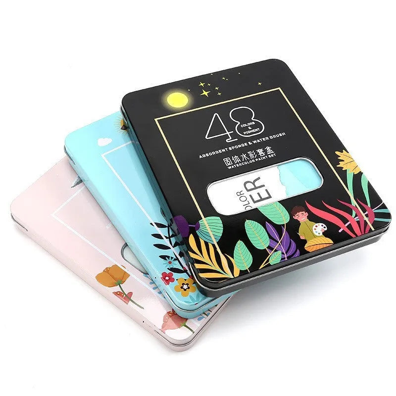 48 colour solid watercolour paint set showing Black Knight, Girl Pink and Sunshine Blue pans in plastic box