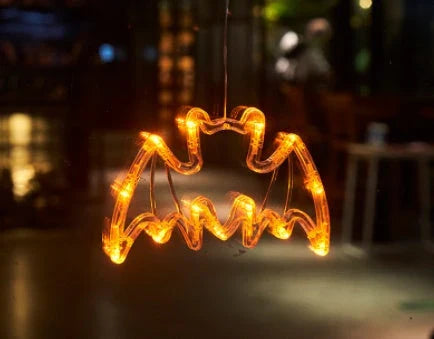 Spooky Halloween window hanging lights featuring pumpkins, spiders, and ghostly figures for a festive atmosphere