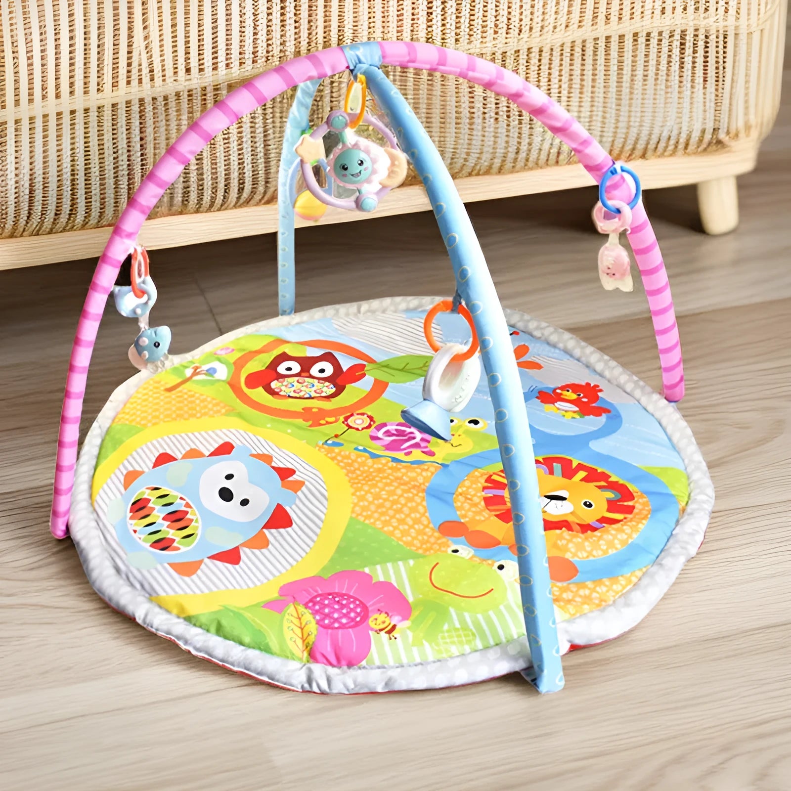 Velvet baby gymnastic rack game blanket in small animal or big animal pattern on floor.