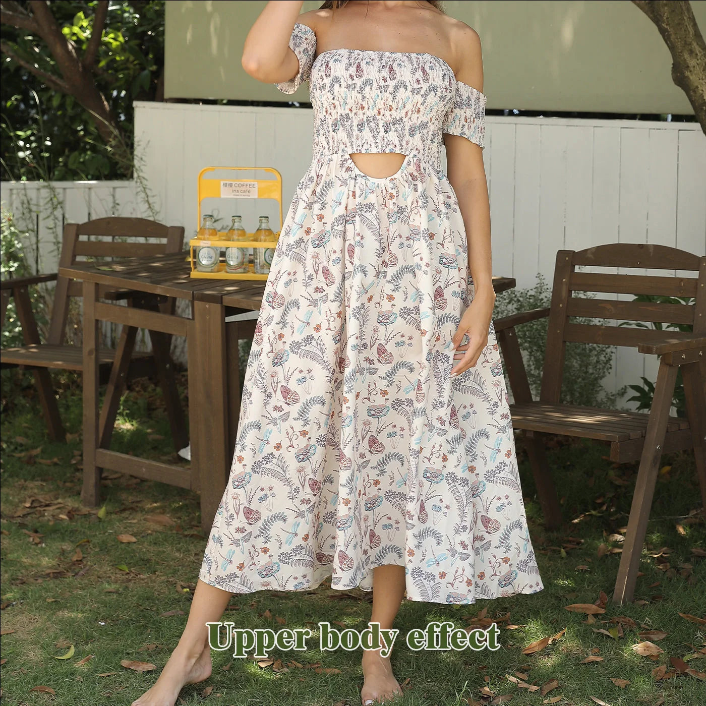 Women's off-shoulder strapless floral dress in a vibrant pattern, perfect for summer outings.