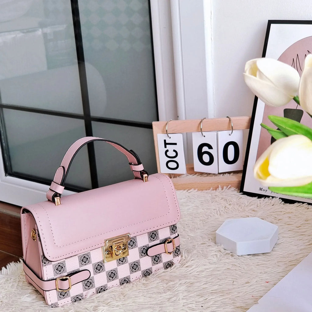 Small square retro patterned crossbody bag in PU leather with a file compartment inside.