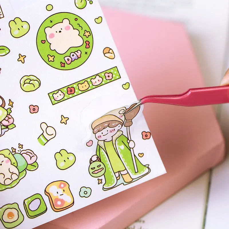 Stainless steel macaron-coloured tweezers in blue, green, and pink with straight and elbow tip styles on paper card packaging