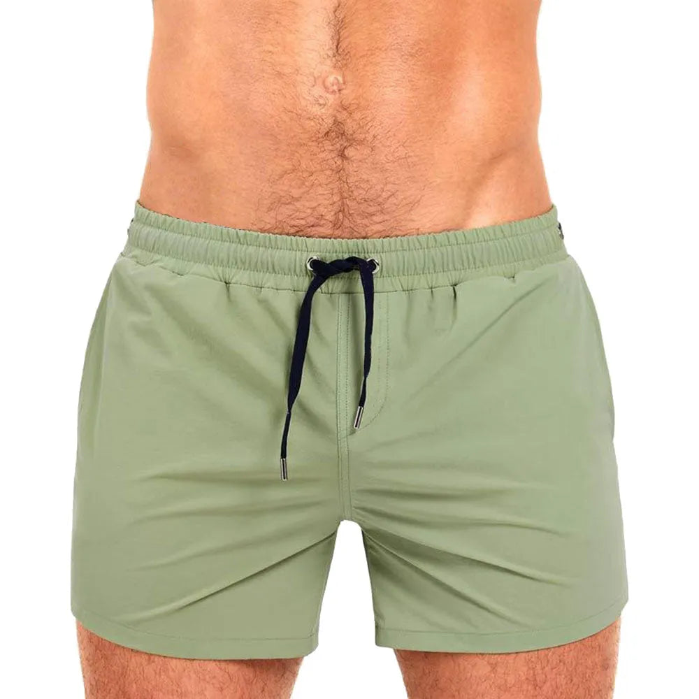 Polyester sports shorts with mesh lining in multiple colours including army green and rose red.