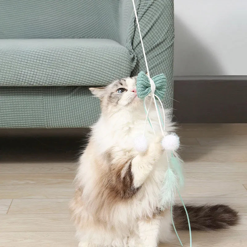 Blue cat teasing toy with long pole, feathered rocket head, and bite-resistant construction.