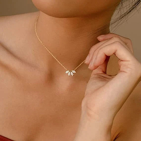 Minimalist lotus flower petal necklace in gold and silver, perfect for parties and everyday wear