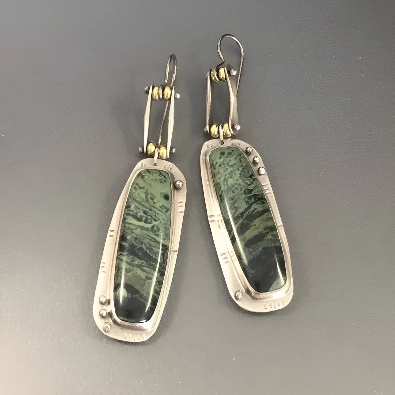 Geometric-shaped alloy earrings with a white and grey two-tone marble pattern.