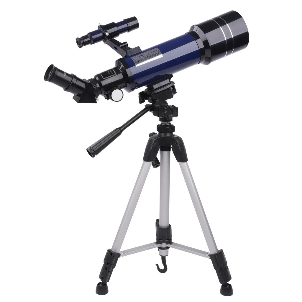 Dark blue and white children's monocular astronomical telescope with tripod on a table.