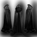 A black satin hooded cloak for children laid flat, showing its length and hood detail.