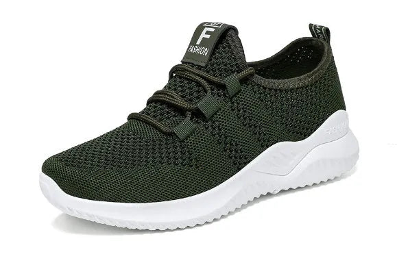 Black steel toe cap safety shoes with low-cut design on a work site background.