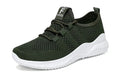 Black steel toe cap safety shoes with low-cut design on a work site background.