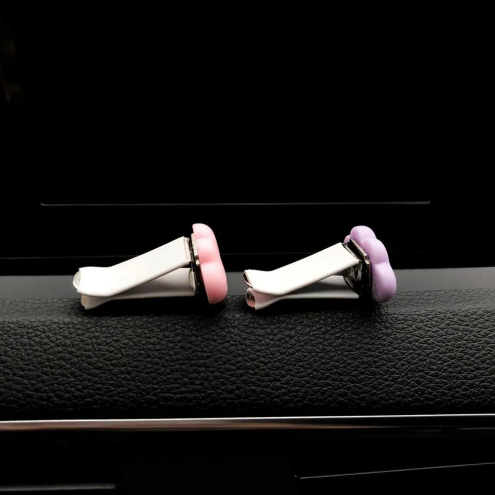 Baiyun cartoon resin car air vent fragrance clip in six colour options.