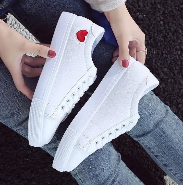Women's PU leather heart pattern flat shoes in white red colour with non-slip rubber sole
