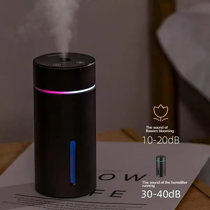 Aluminium portable car air humidifier and essential oil diffuser with coloured night light on.