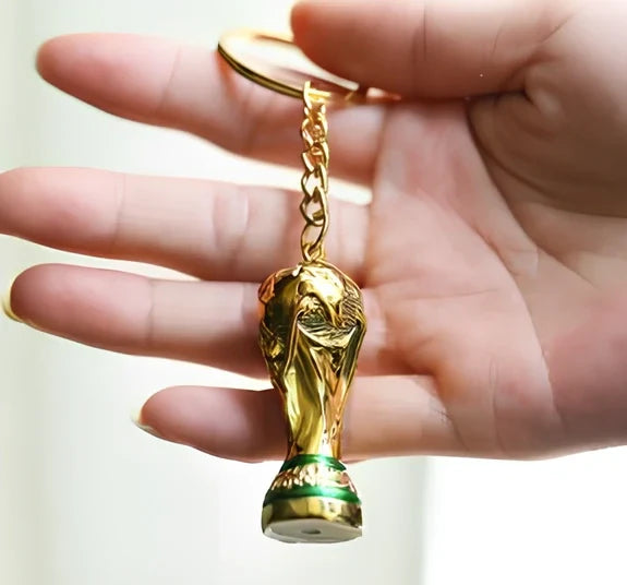 Synthetic resin World Cup keychain 5cm long with green-white logo and metal ring