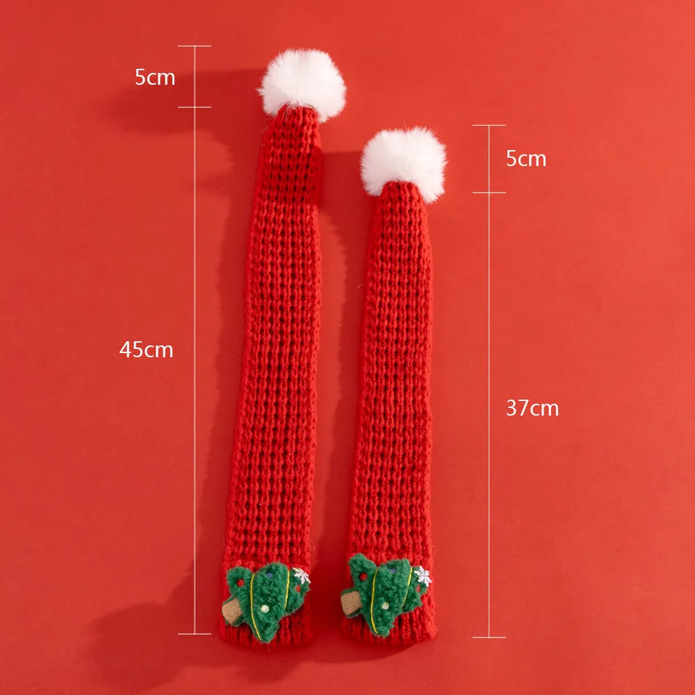 Christmas cat scarf with striped cartoon pattern in festive colours on a light background
