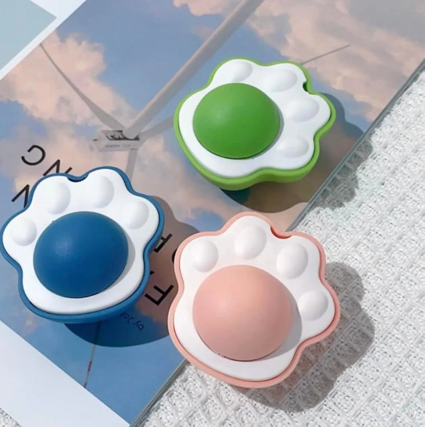 Colourful catnip balls with textured edible vine surfaces for feline dental care and interactive play