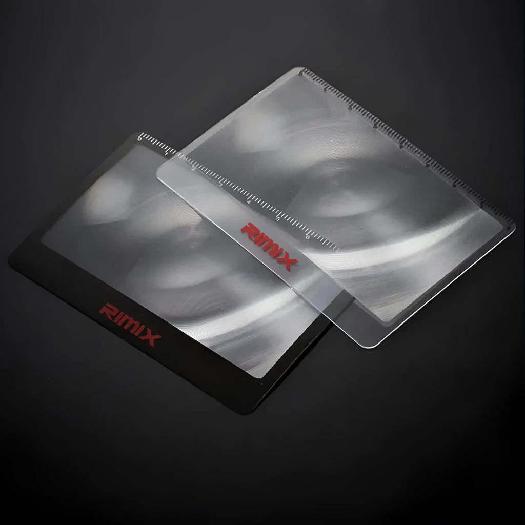 Black and white portable plastic card magnifier for reading and outdoor use.