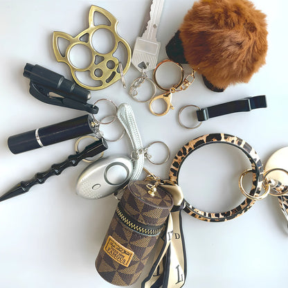 Black self-defence keychain set with alarm, bottle opener, and multiple protection tools