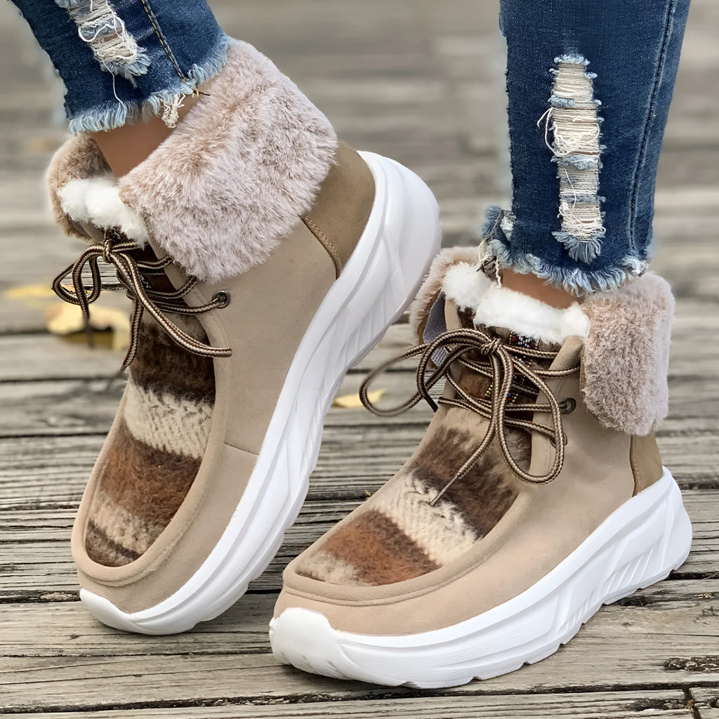 Beige women's lace-up suede snow boots with fuzzy lining and a thick soft sole platform.