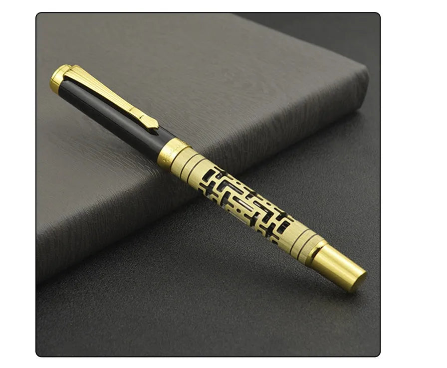 Yellow bronze metal fountain pen with iridium nib, 0.7mm big point, and gold trim, lying on a light surface