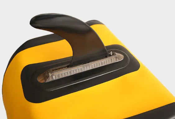 SUP paddle with large removable fish fins showing plastic construction and detachable components